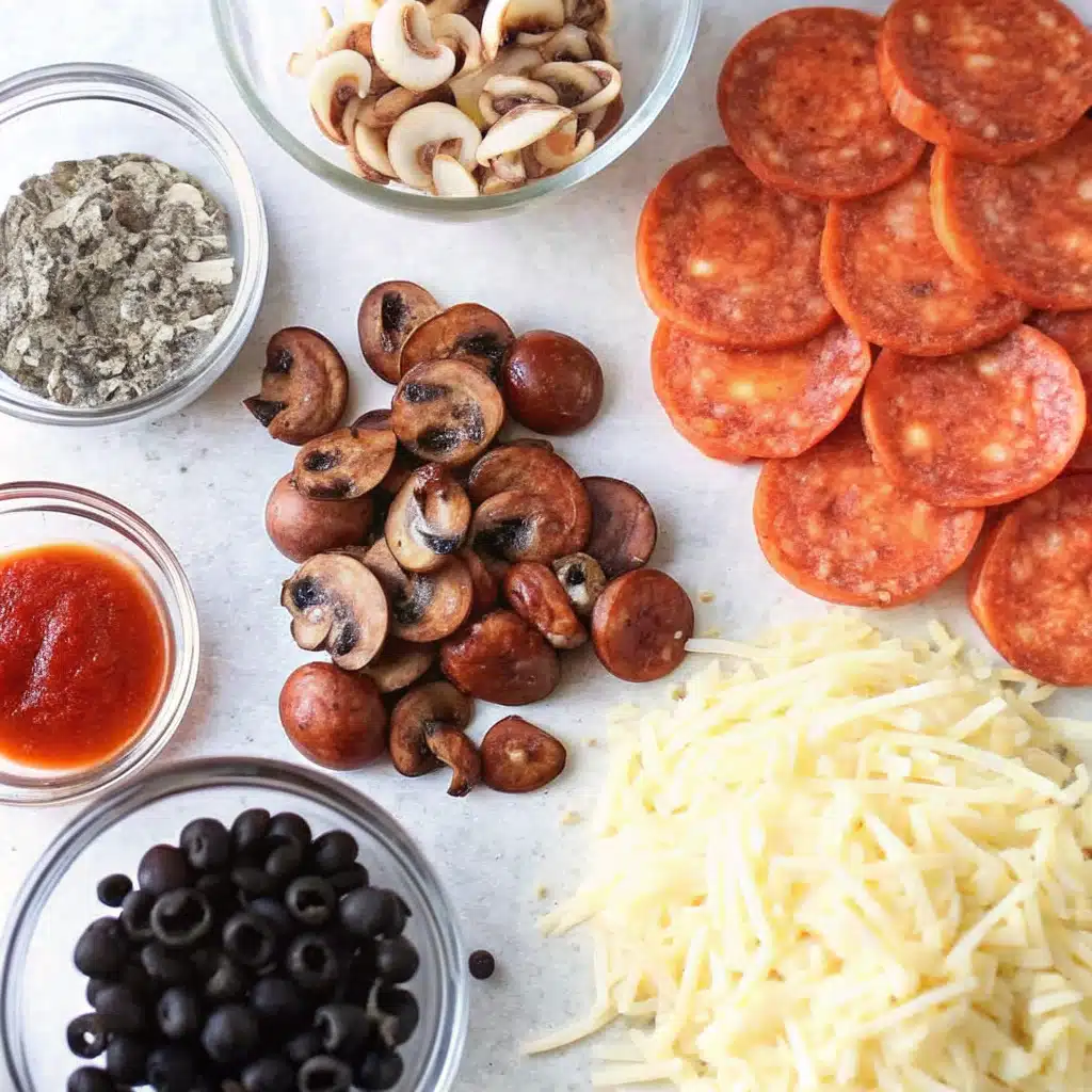 Ingredients for homemade sheet pan pizza laid out on a table