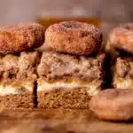 A square of Apple Cider Coffee Cake showing the moist apple cider spiced crumb with crunchy streusel topping and apple cider glaze drizzle on a white plate