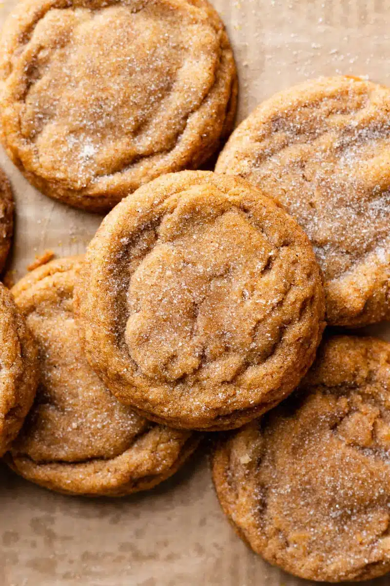 Home 3 Chewy Pumpkin Snickerdoodle Cookies beautifully crinkled brown butter fall cookies with deeply spiced cinnamon-pumpkin-nutmeg sugar coating on a white plate on marble