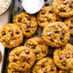 Close-up of a Pumpkin Oatmeal Cookie showing the hearty rolled oat texture with chocolate chips and warm pumpkin spice fall crumb